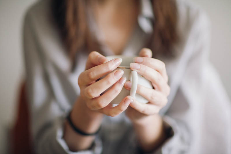 Holding a cup of coffee. Portrait session with the youthful Sunny. Lika Banshoya